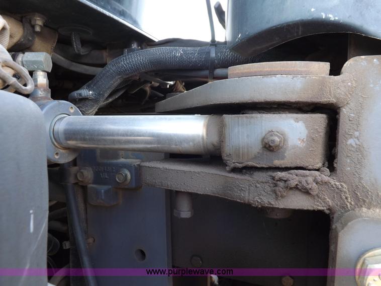 image for item H9112 1999 New Holland TV140 bi-directional MFWD tractor