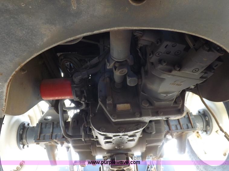 image for item H9112 1999 New Holland TV140 bi-directional MFWD tractor