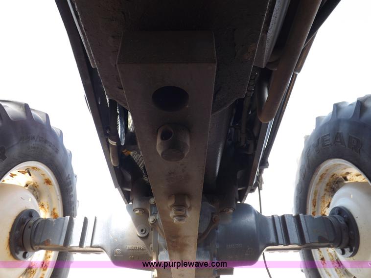 image for item H9112 1999 New Holland TV140 bi-directional MFWD tractor