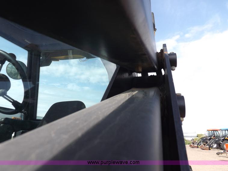 image for item H9112 1999 New Holland TV140 bi-directional MFWD tractor