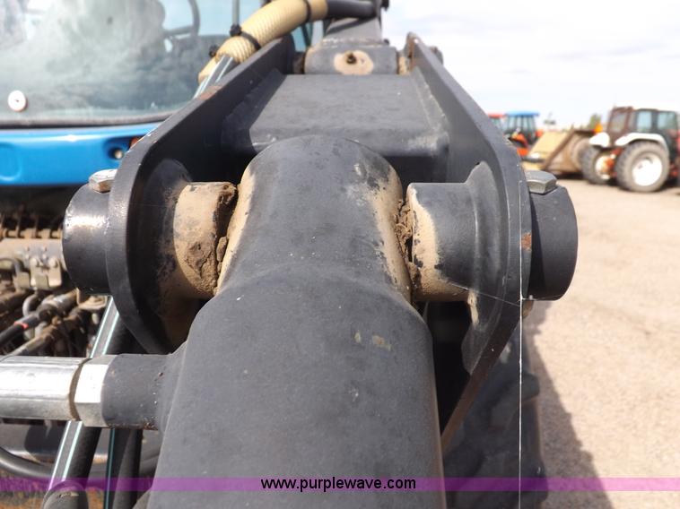 image for item H9112 1999 New Holland TV140 bi-directional MFWD tractor