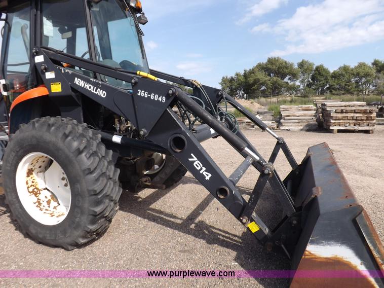 image for item H9112 1999 New Holland TV140 bi-directional MFWD tractor