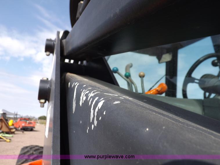 image for item H9112 1999 New Holland TV140 bi-directional MFWD tractor