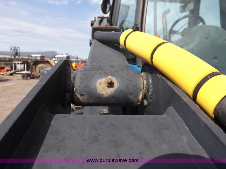 image for item H9112 1999 New Holland TV140 bi-directional MFWD tractor