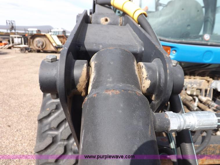 image for item H9112 1999 New Holland TV140 bi-directional MFWD tractor