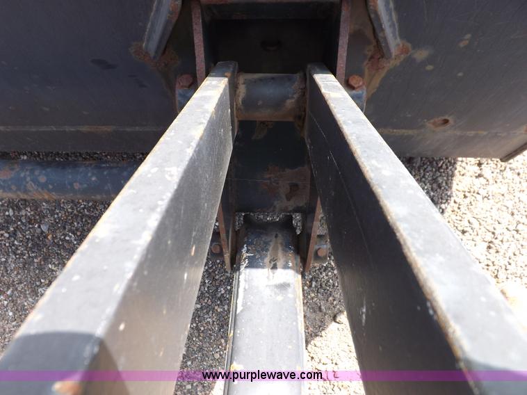 image for item H9112 1999 New Holland TV140 bi-directional MFWD tractor