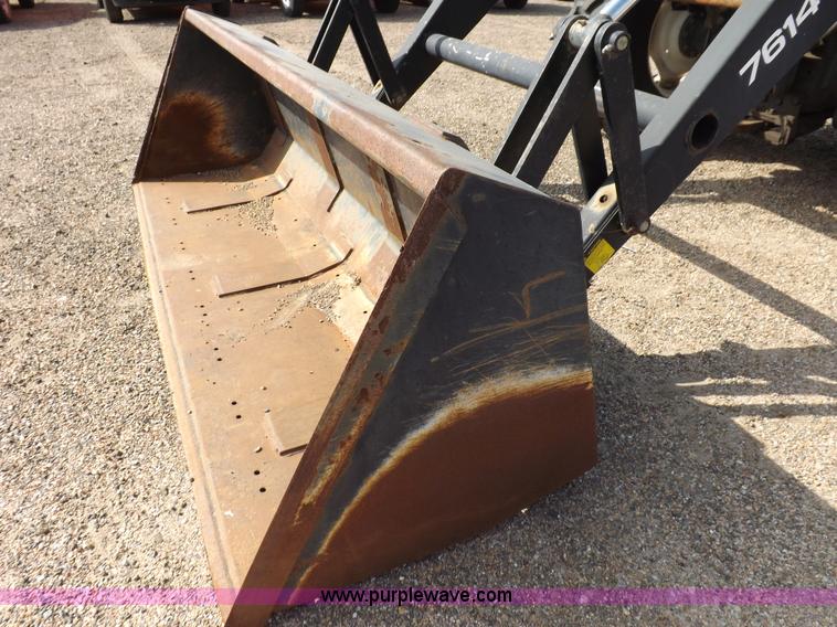 image for item H9112 1999 New Holland TV140 bi-directional MFWD tractor