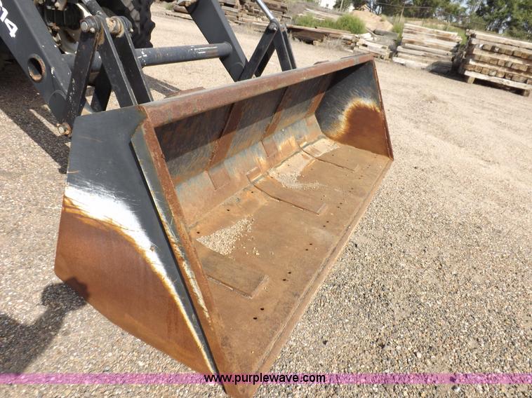 image for item H9112 1999 New Holland TV140 bi-directional MFWD tractor