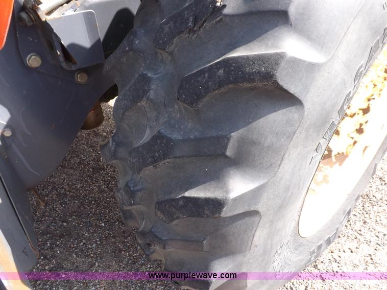 image for item H9112 1999 New Holland TV140 bi-directional MFWD tractor