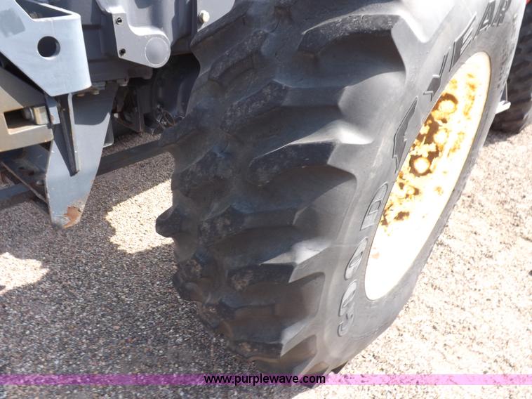 image for item H9112 1999 New Holland TV140 bi-directional MFWD tractor