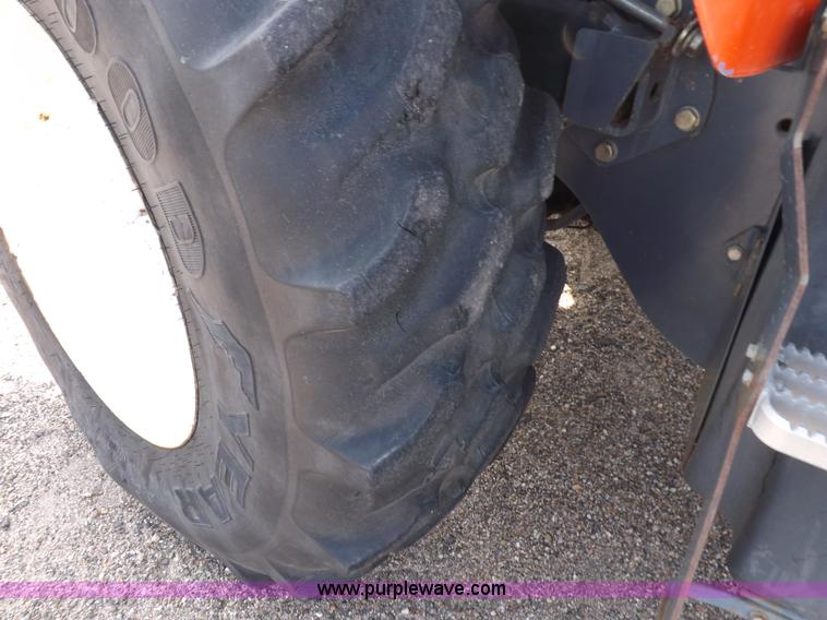 image for item H9112 1999 New Holland TV140 bi-directional MFWD tractor