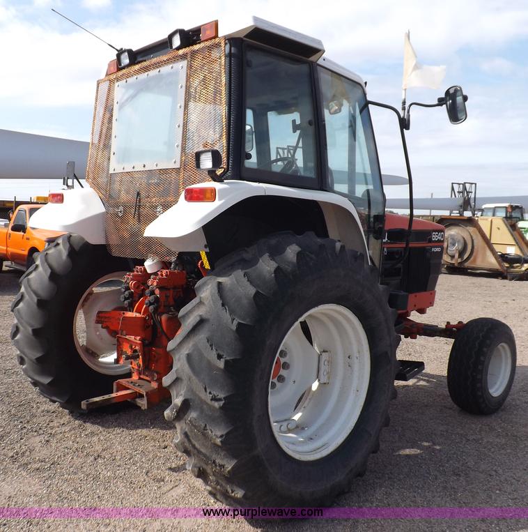 image for item H9113 1997 New Holland 6640SL tractor