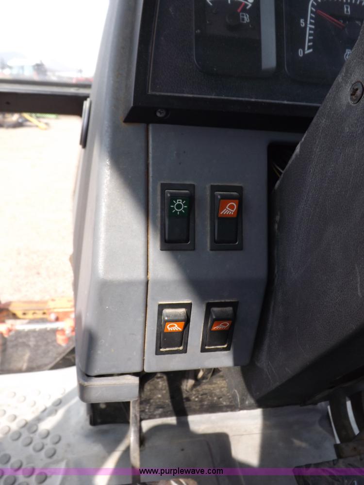 image for item H9113 1997 New Holland 6640SL tractor