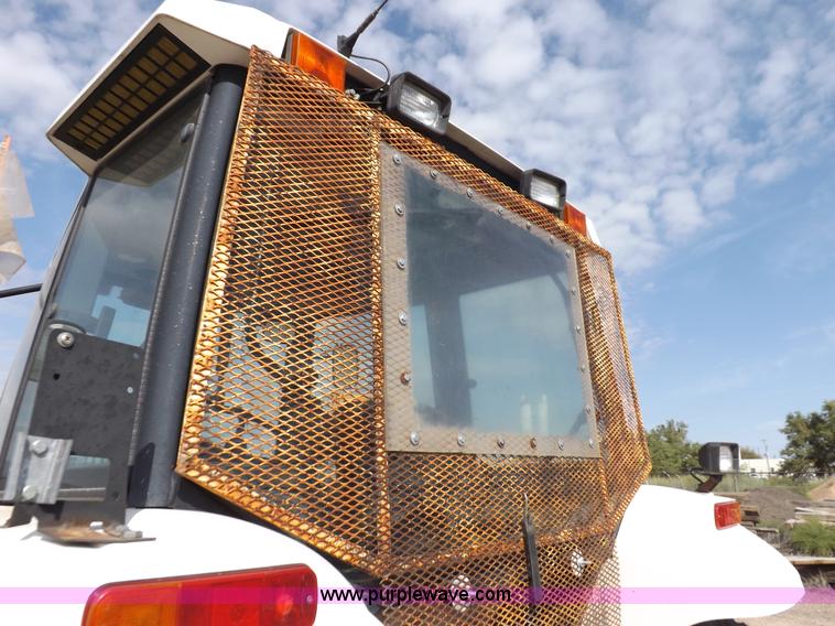 image for item H9113 1997 New Holland 6640SL tractor