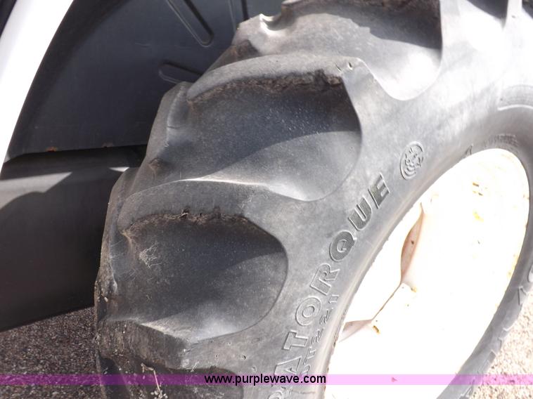 image for item H9113 1997 New Holland 6640SL tractor