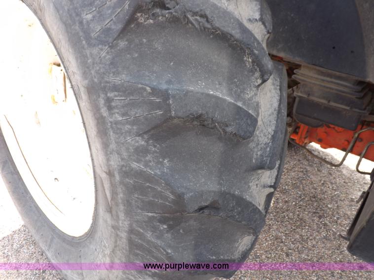 image for item H9113 1997 New Holland 6640SL tractor