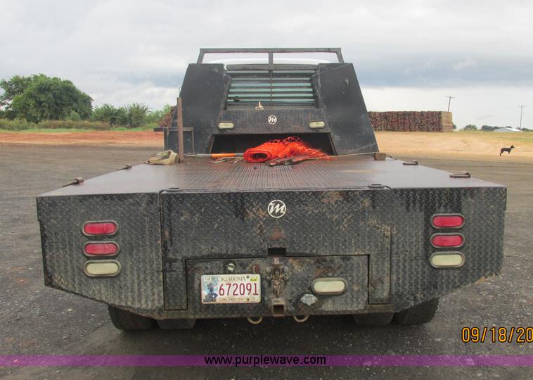 image for item J2466 2000 Ford F650 Crew Cab flatbed truck