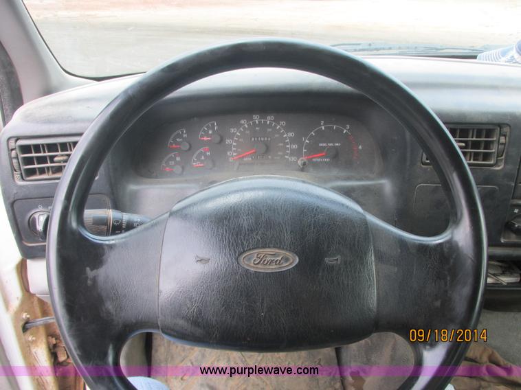 image for item J2466 2000 Ford F650 Crew Cab flatbed truck