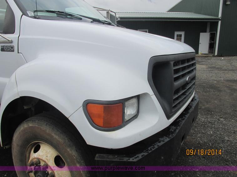 image for item J2466 2000 Ford F650 Crew Cab flatbed truck