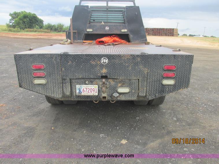 image for item J2466 2000 Ford F650 Crew Cab flatbed truck