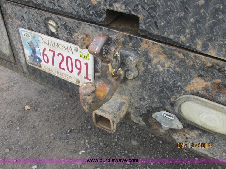 image for item J2466 2000 Ford F650 Crew Cab flatbed truck