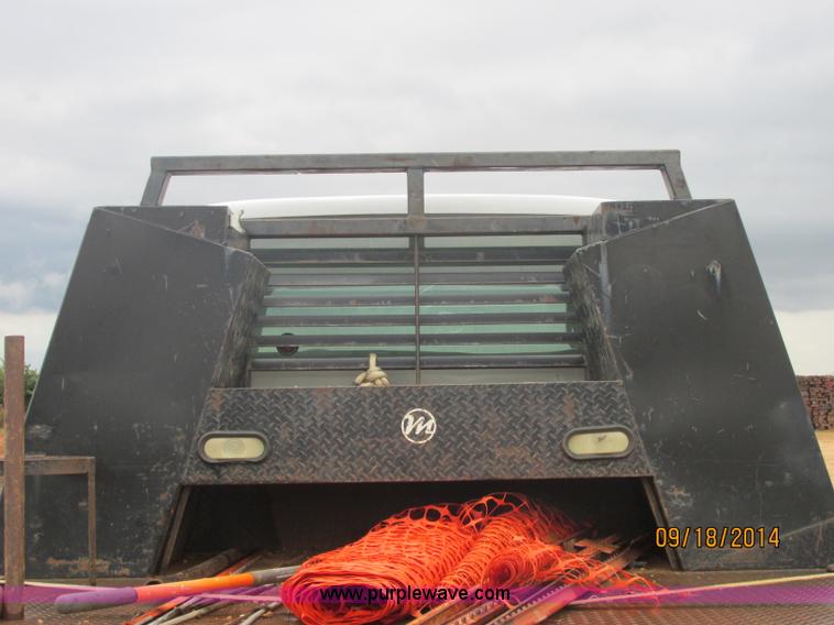 image for item J2466 2000 Ford F650 Crew Cab flatbed truck