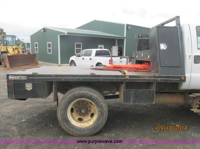 image for item J2466 2000 Ford F650 Crew Cab flatbed truck