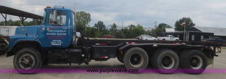 image for item D2145 1985 Mack DM686S roll off truck