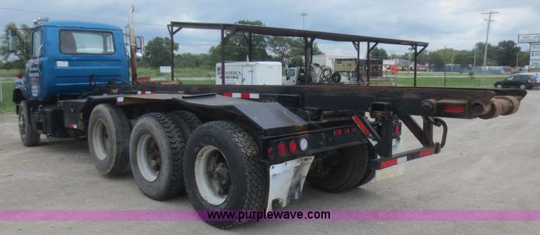 image for item D2145 1985 Mack DM686S roll off truck