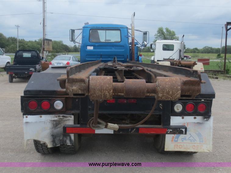 image for item D2145 1985 Mack DM686S roll off truck