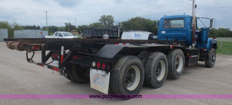 image for item D2145 1985 Mack DM686S roll off truck