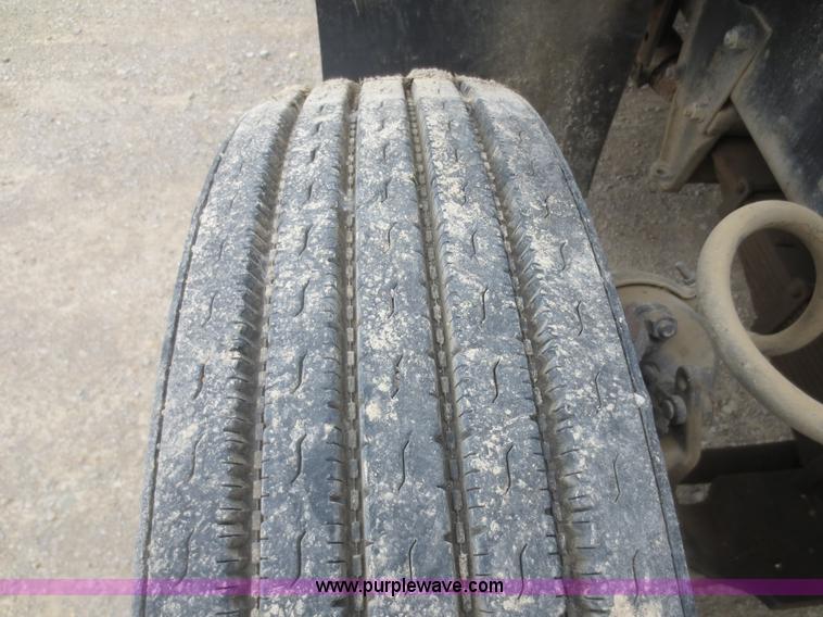 image for item D2145 1985 Mack DM686S roll off truck