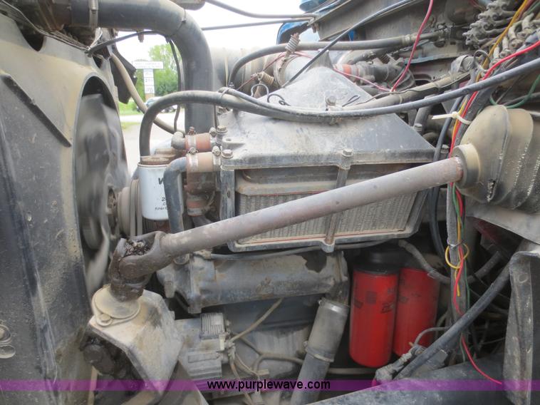 image for item D2145 1985 Mack DM686S roll off truck