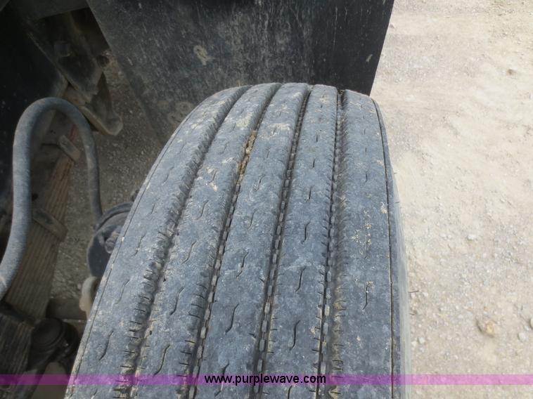 image for item D2145 1985 Mack DM686S roll off truck