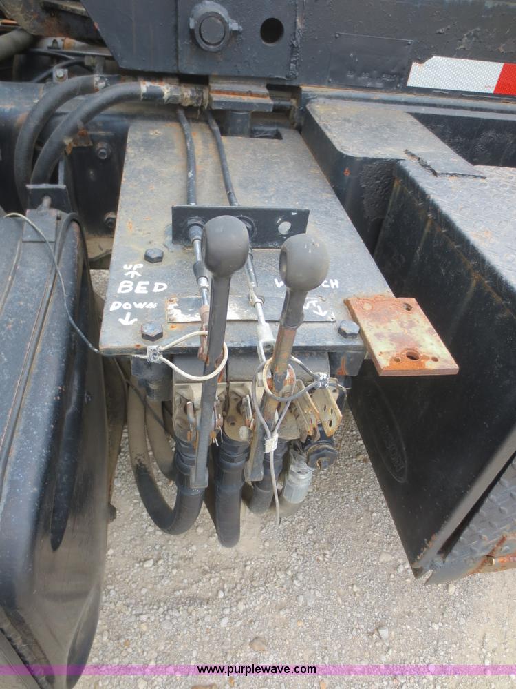 image for item D2145 1985 Mack DM686S roll off truck