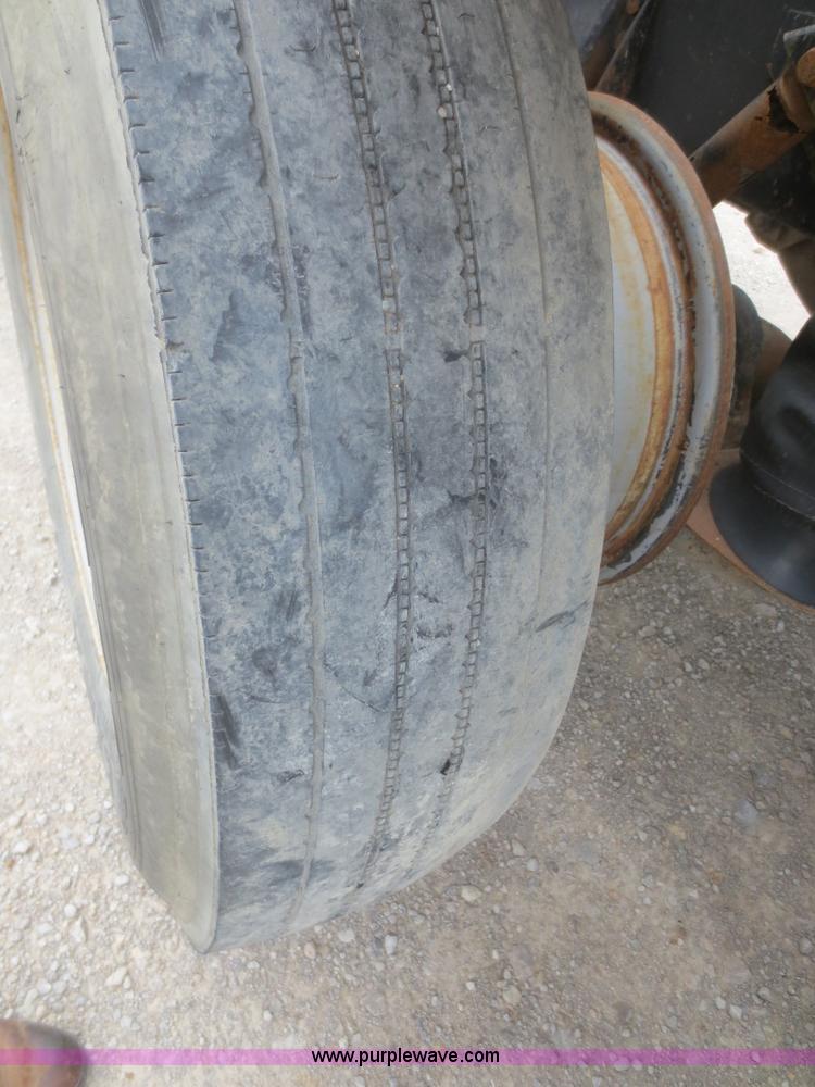 image for item D2145 1985 Mack DM686S roll off truck