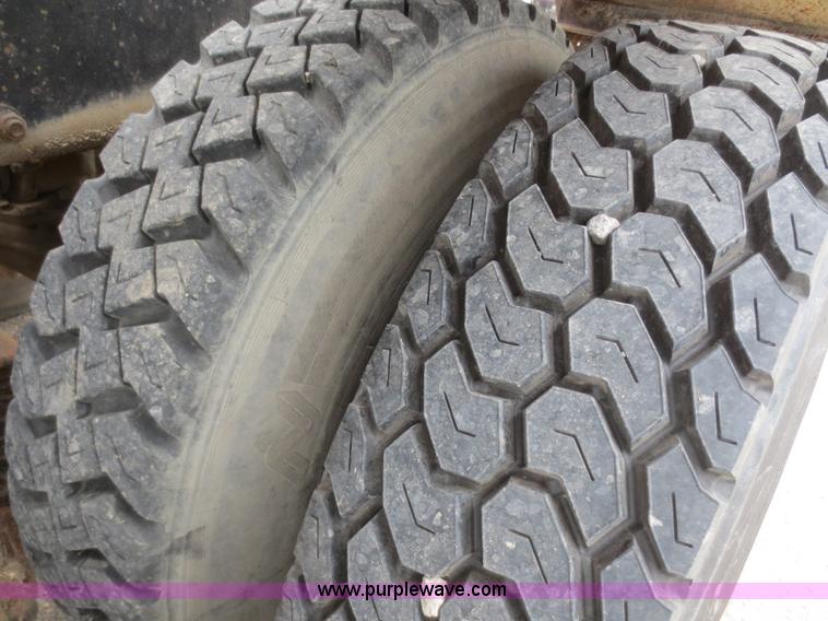 image for item D2145 1985 Mack DM686S roll off truck