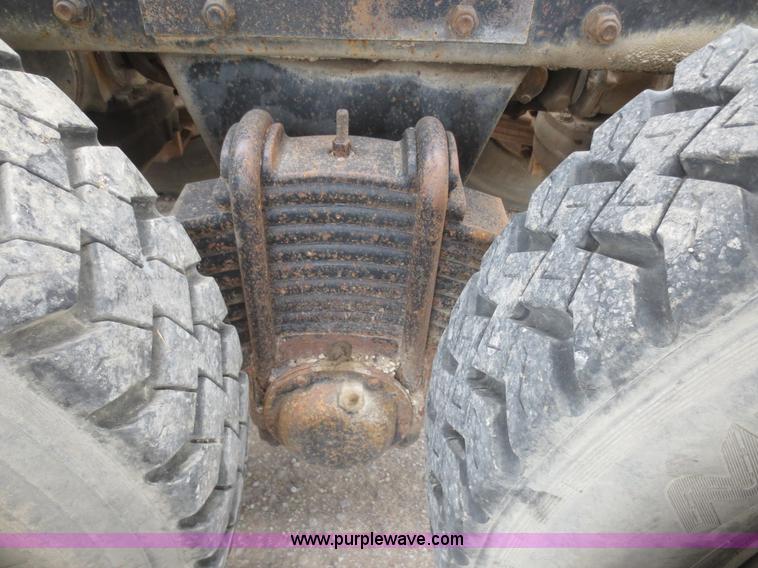 image for item D2145 1985 Mack DM686S roll off truck