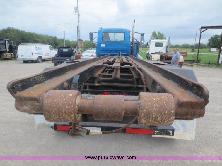 image for item D2145 1985 Mack DM686S roll off truck