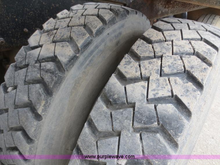 image for item D2145 1985 Mack DM686S roll off truck