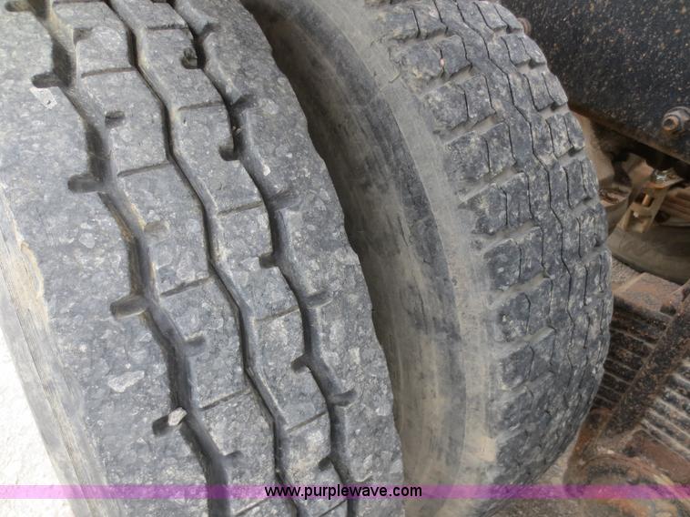 image for item D2145 1985 Mack DM686S roll off truck