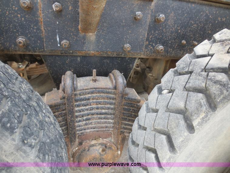 image for item D2145 1985 Mack DM686S roll off truck