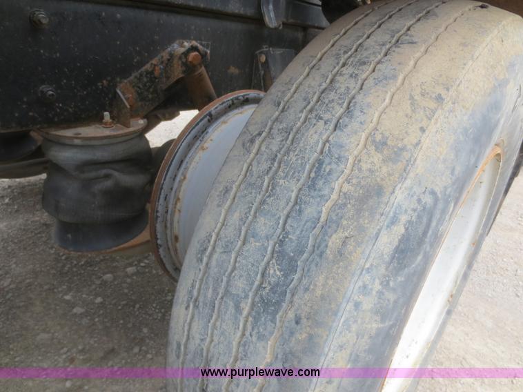 image for item D2145 1985 Mack DM686S roll off truck