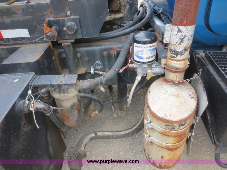 image for item D2145 1985 Mack DM686S roll off truck