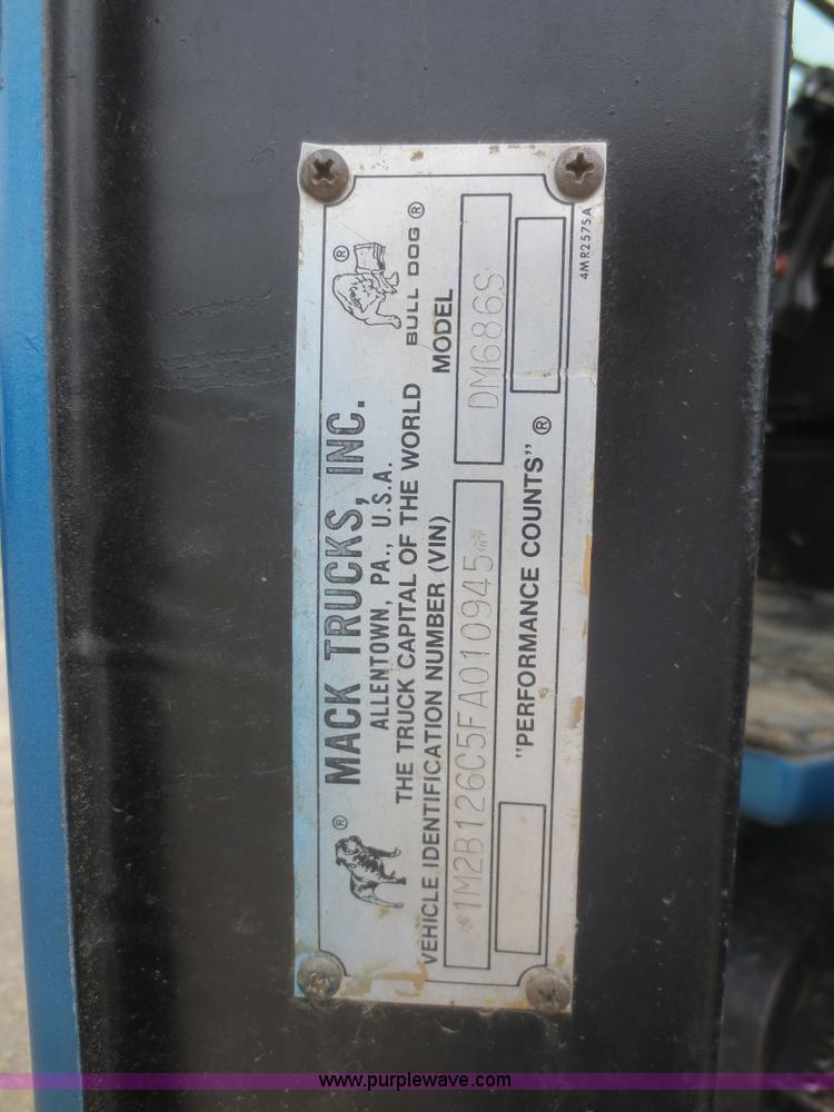 image for item D2145 1985 Mack DM686S roll off truck