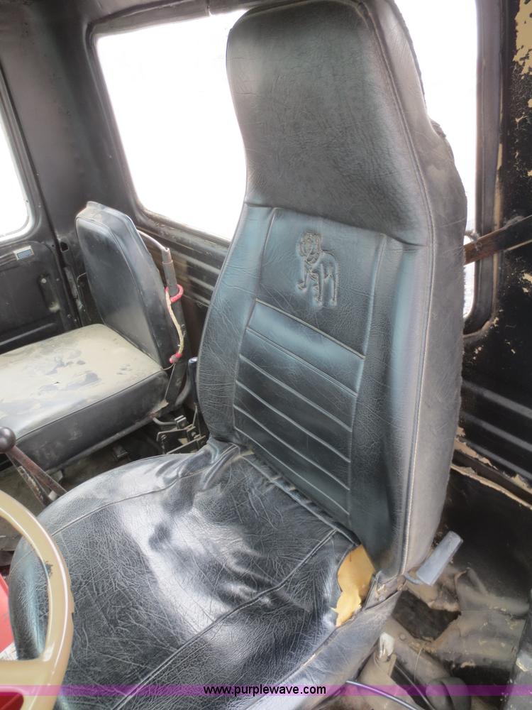 image for item D2145 1985 Mack DM686S roll off truck