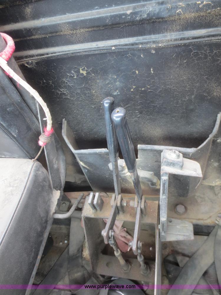 image for item D2145 1985 Mack DM686S roll off truck