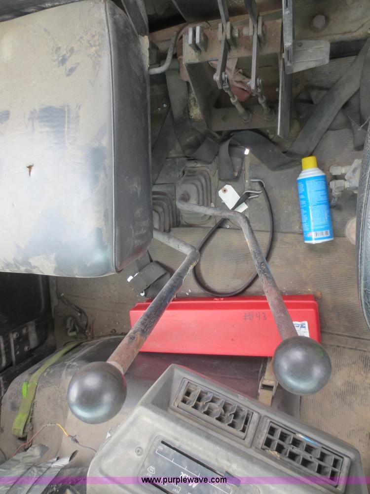 image for item D2145 1985 Mack DM686S roll off truck