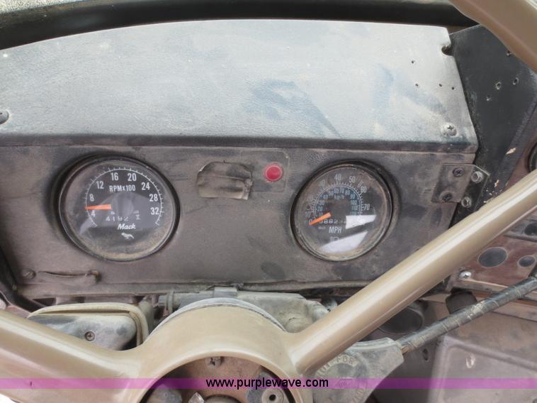 image for item D2145 1985 Mack DM686S roll off truck