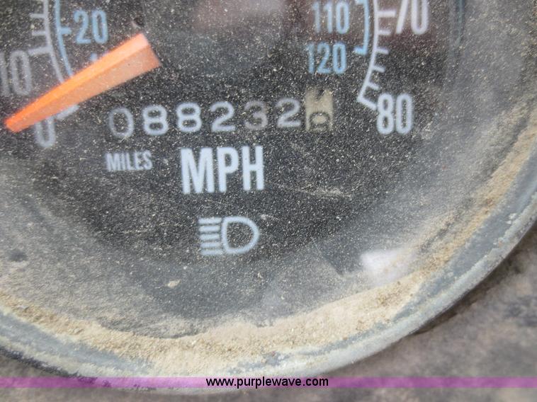 image for item D2145 1985 Mack DM686S roll off truck